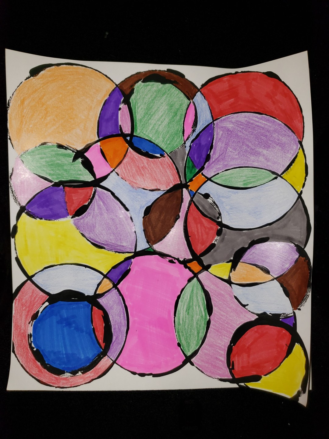 Circle art, made by painting overlapping circles onto a page then colouring in each section a different colour. Mixed Media art.